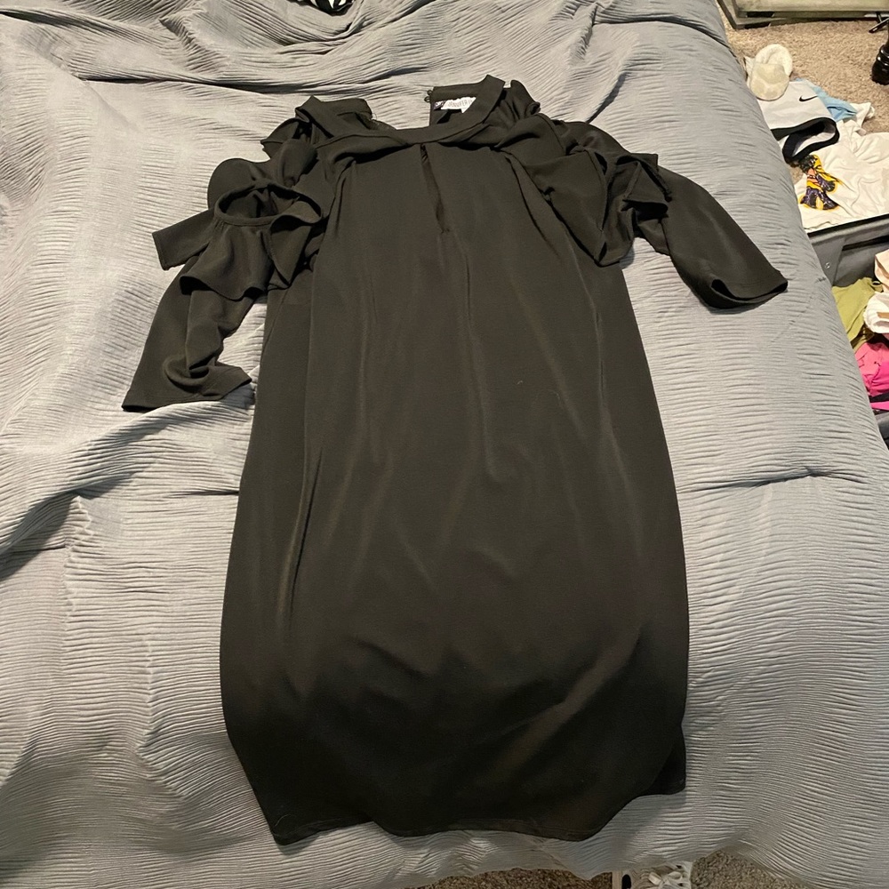Cute black going out dress. Cut shoulder, mid thigh length